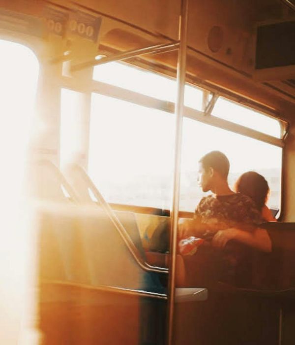 Silhouette of a man in a balanced pose against a warm light.